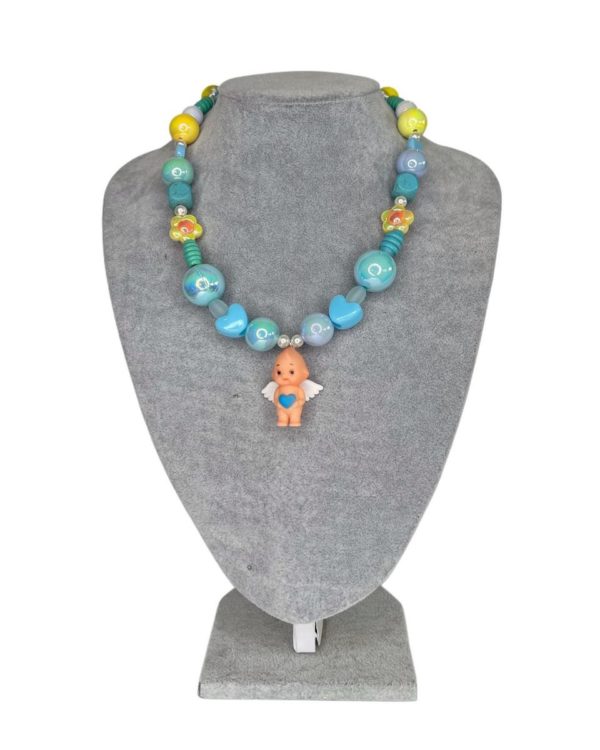 Kewpie baby doll necklace by Diana Rikasari