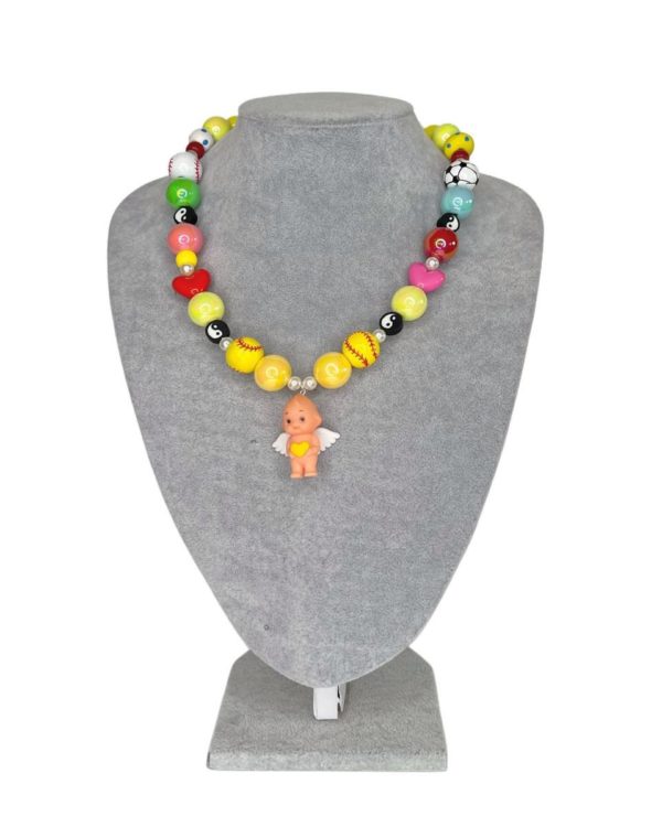 Kewpie baby doll necklace by Diana Rikasari
